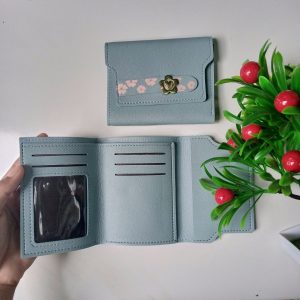 ini adalah Dompet Bunga Cinta Biru, size: 12cm x 9 cm, material: synthetic, color: light blue, brand: dompetbungacintakanor, age_group: all ages, gender: female